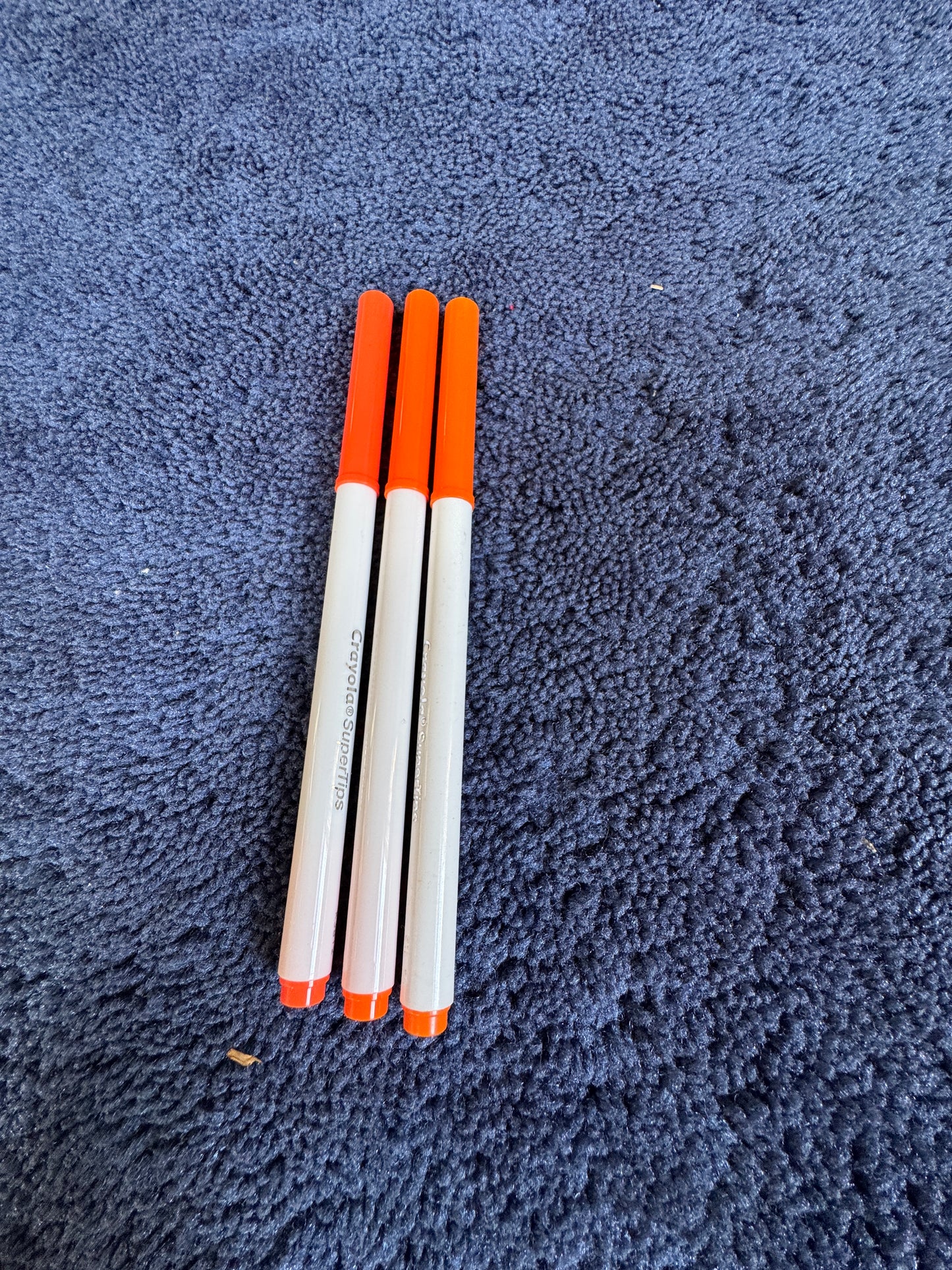Dark orange Crayola marker.